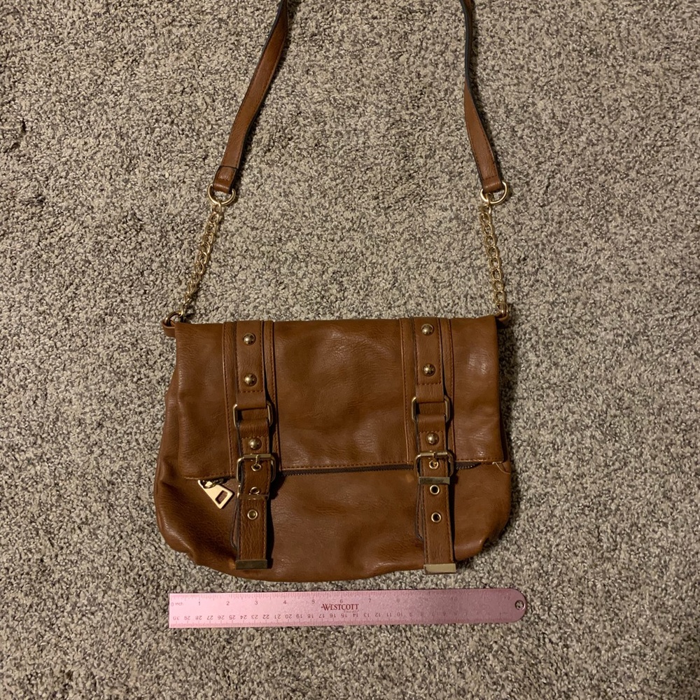 Brown cross body with bucket accent straps